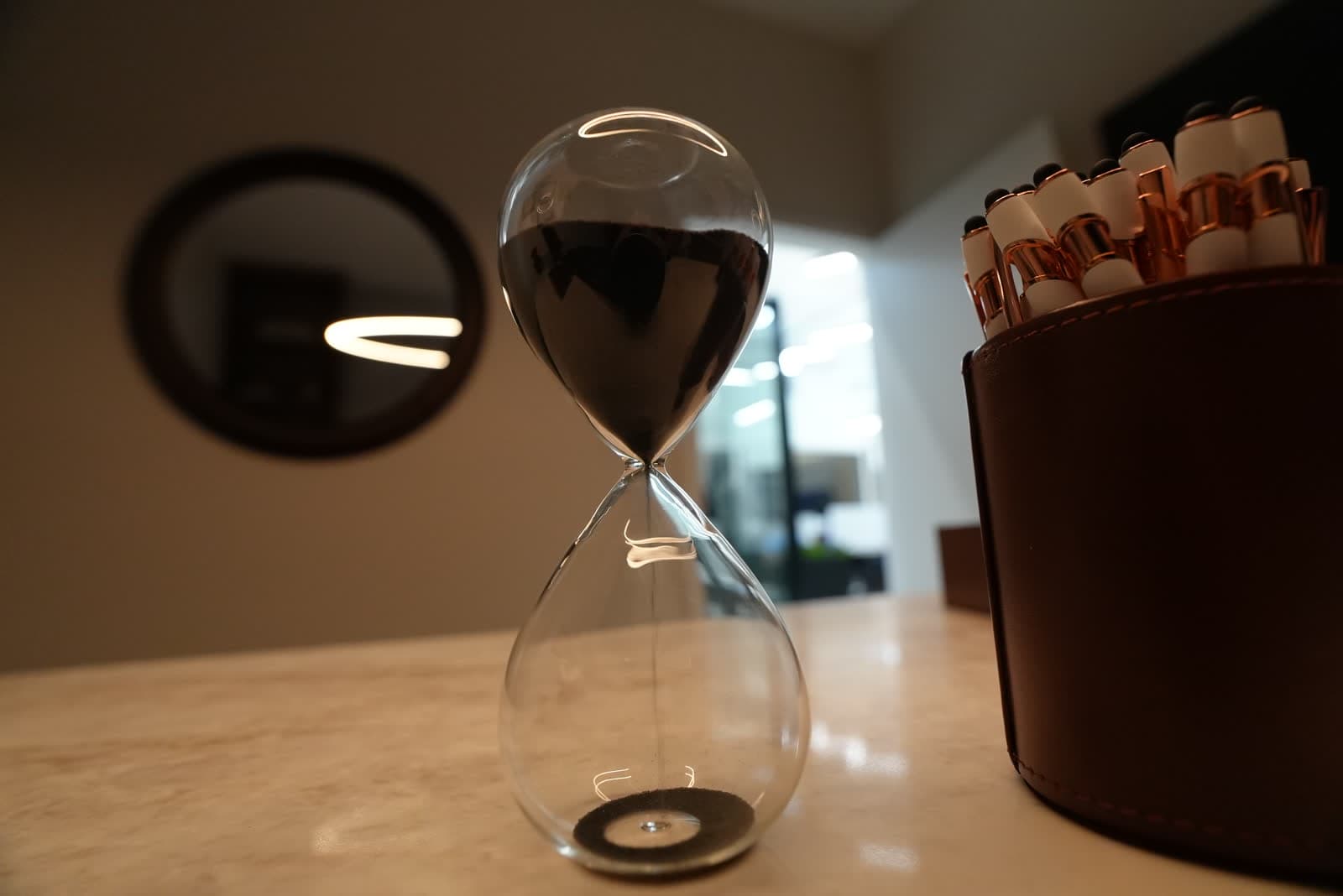 Hourglass on a marble desk