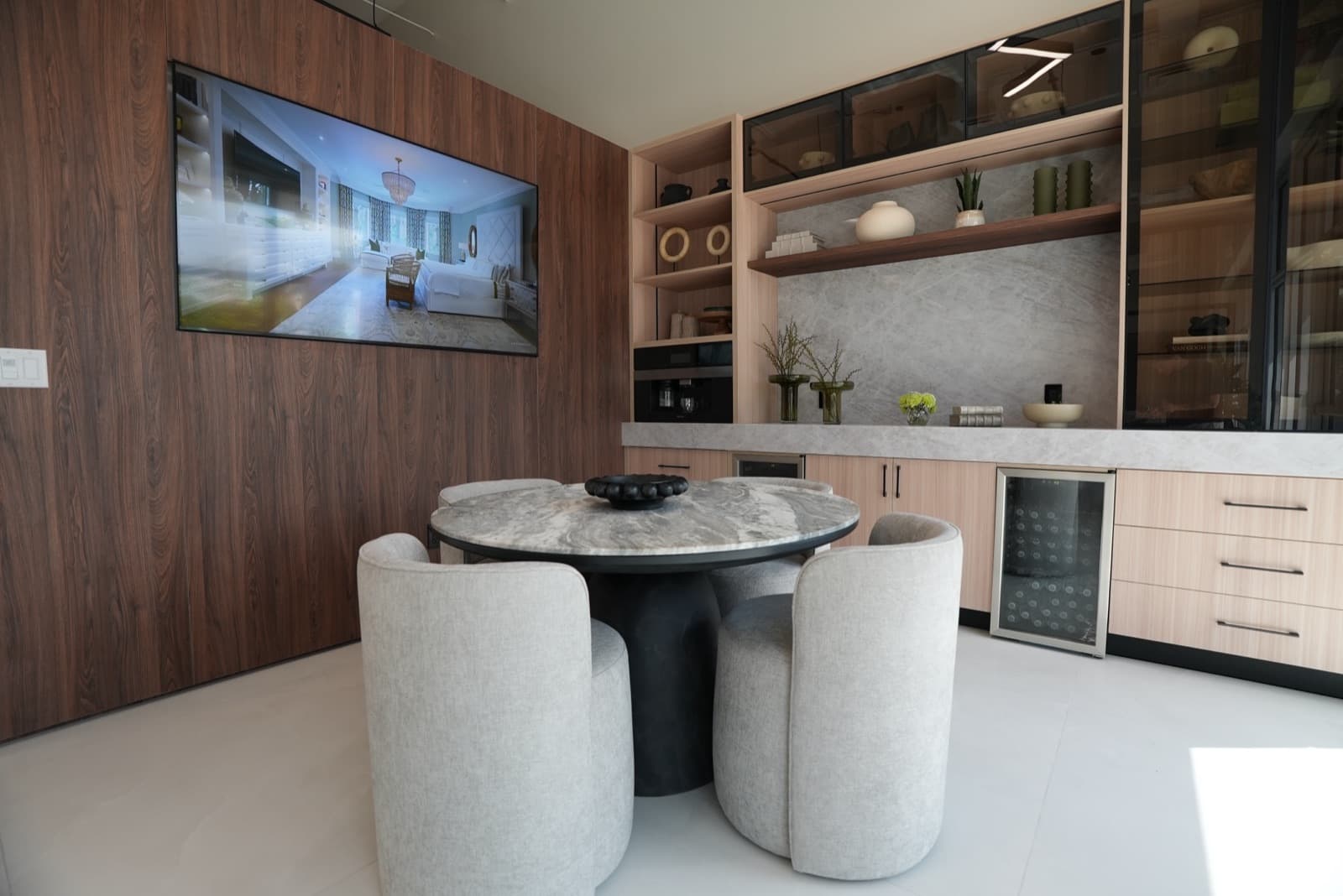 Client lounge with marble table and coffee bar in Doral
