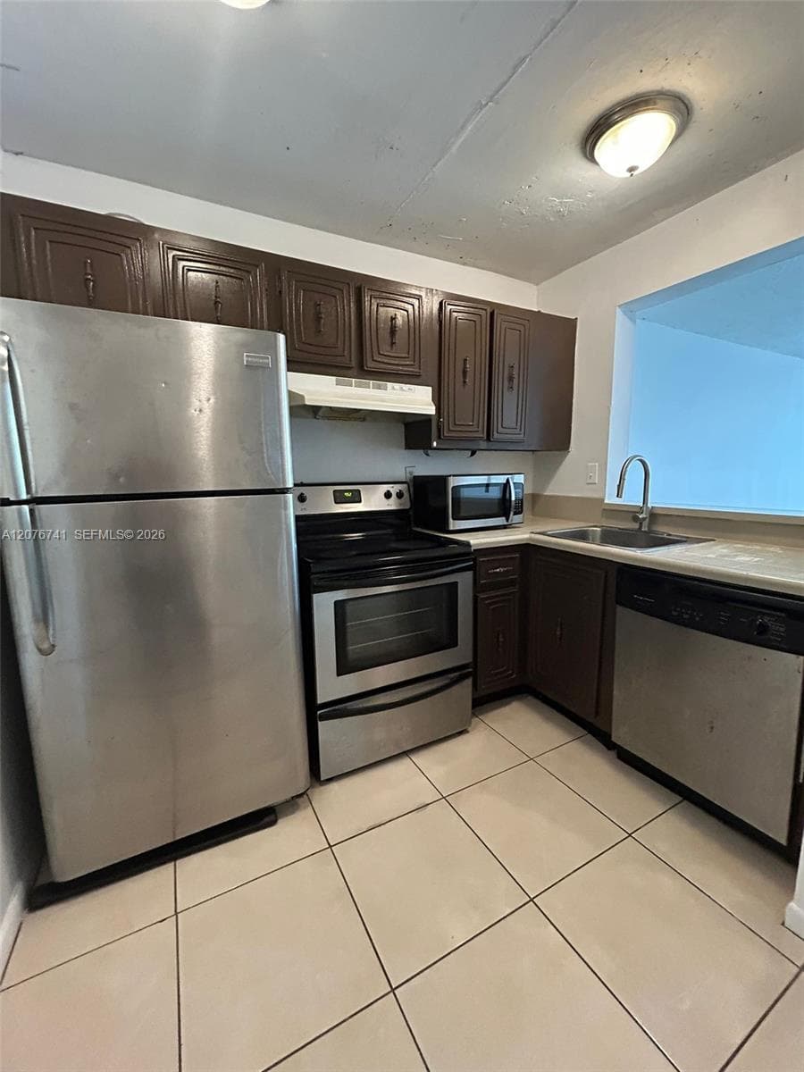 496 NW 165th St Rd # 310, Miami FL 33169